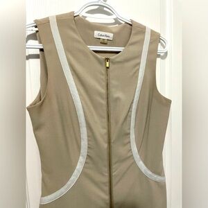 Sleeveless Tan dress with White detailing. Size 4